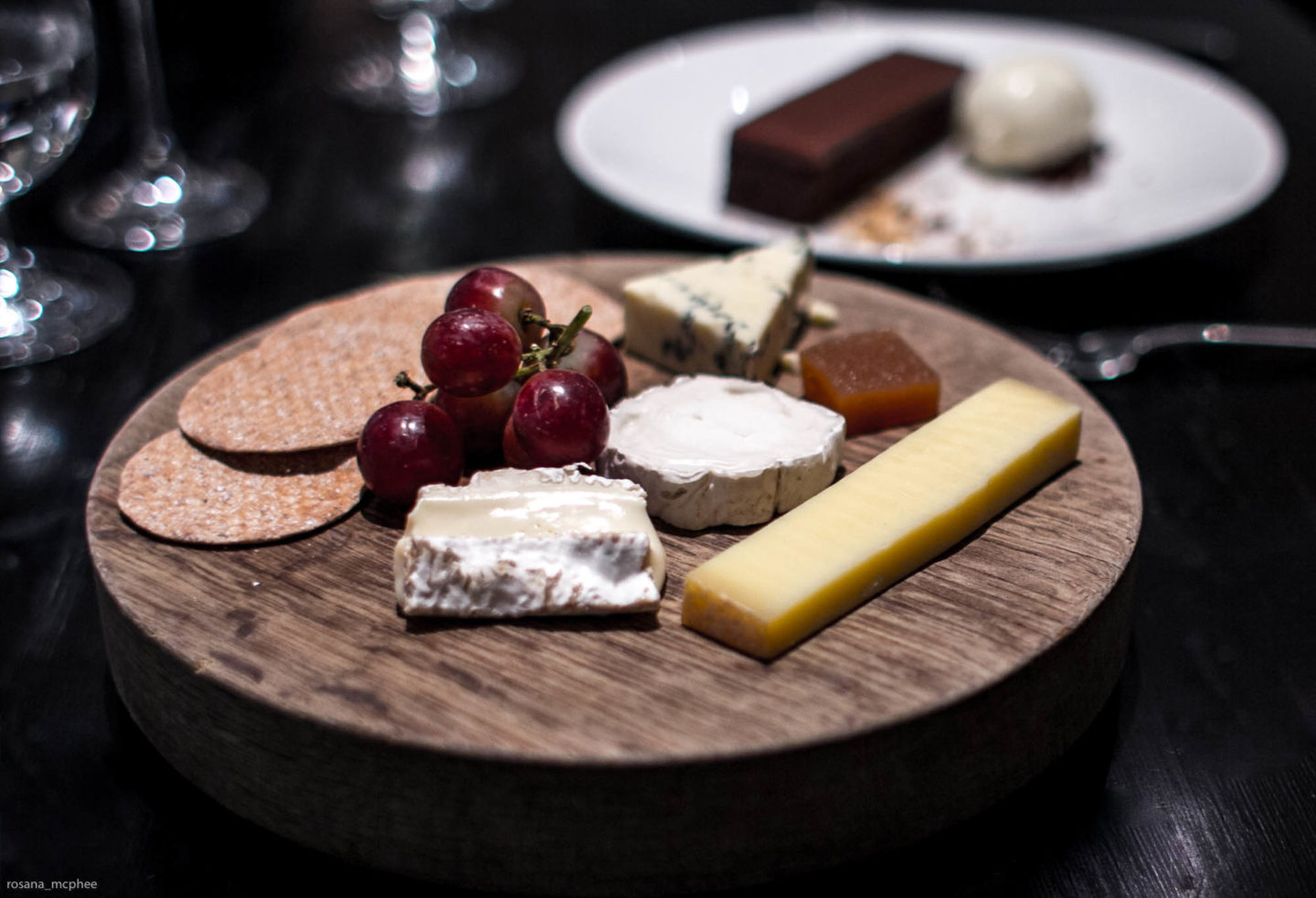 selection of British cheeses - cow, sheep and goats cheeses, with quince jelly and crackers